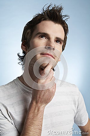 Man With Hand On Chin Looking Up
