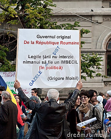 Man holding a banner and protesting