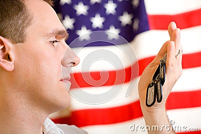 Man holding dog-tags