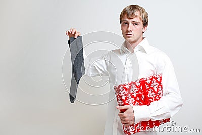 Man holding gift and sock