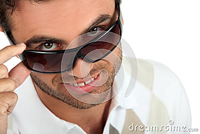 man-holding-his-sunglasses-22063543.jpg