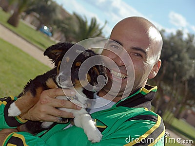 Man Holding Pet Dog