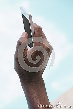 Man holding smartphone in hand