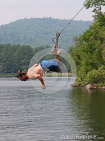 Man on a lake swing