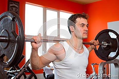 Man lifting weights at the gym