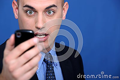 Man looking at mobile telephone