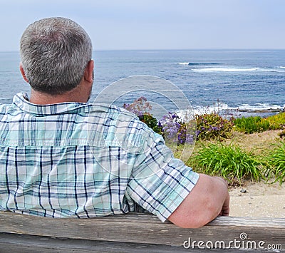 Man looking at the ocean view