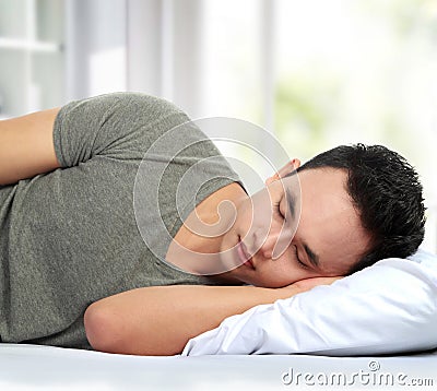 Man lying in bed sleeping