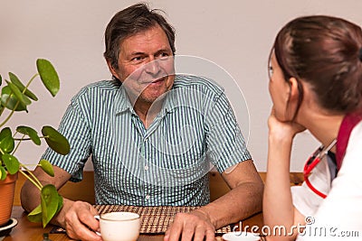 Man and nurse having a conversation