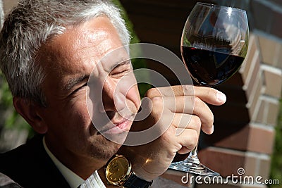 Man observing color in wine
