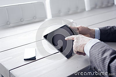 Man in the office using tablet pc