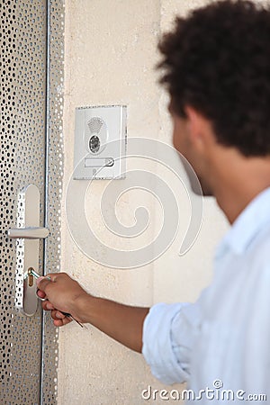 Man opening door with key