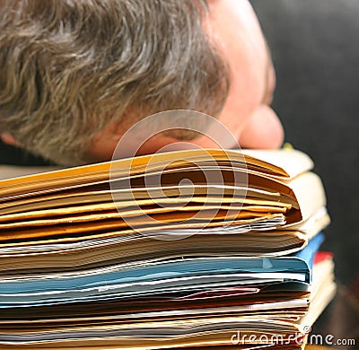 Man overwhelmed with office work