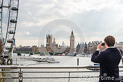 Man photographing London skyline