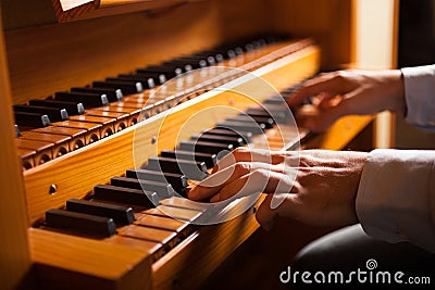 Man playing a church organ