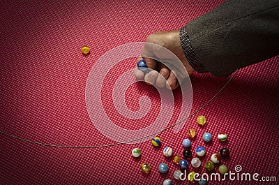 Man playing marbles