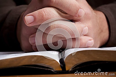 Man Praying with Bible