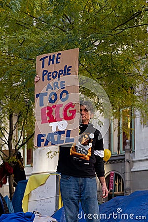Man with protest sign at Occupy Wall Street