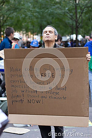 Man with protest sign at Occupy Wall Street