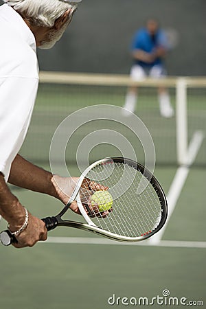 Man Ready To Serve A Tennis Ball