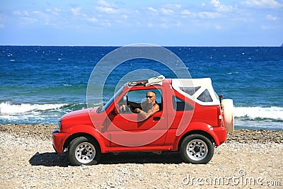 Man with red jeep