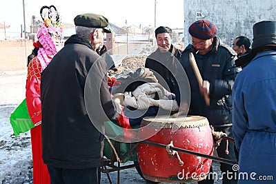 The man in red traditional coat Hit the drum