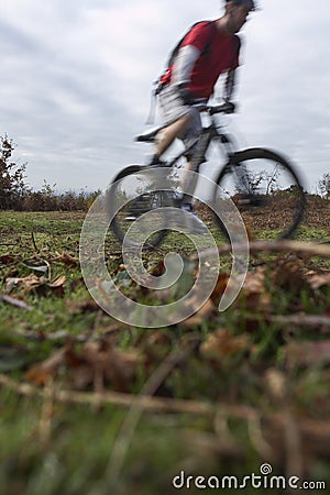 Man Riding Bike On Countryside