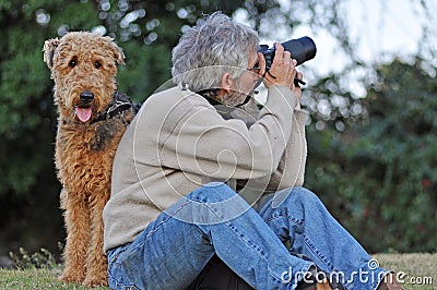 Man s best friend. Photographer and Airedale dog.