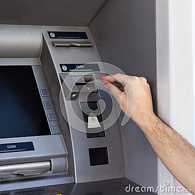 Man s hand using the ATM