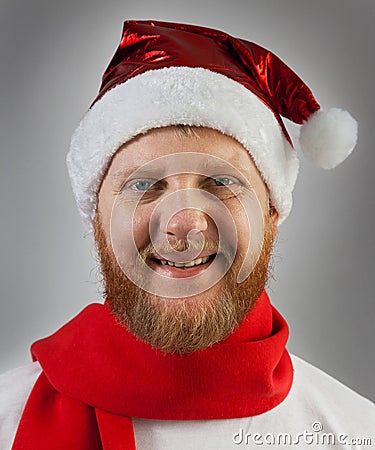 Man in a Santa Claus hat and red scarf