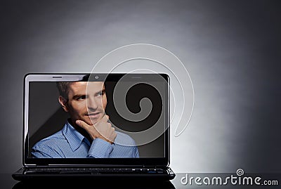 Man on the screen of a laptop