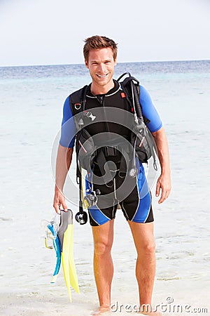 Man With Scuba Diving Equipment Enjoying Beach Holiday