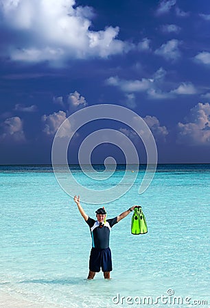 Man in the sea with the equipment for a snorkeling