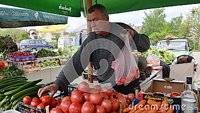 Man selling vegetables at market