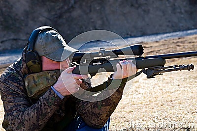 Man Shooting Rifle