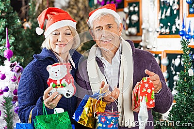 Man Shopping For Christmas With Woman In Store