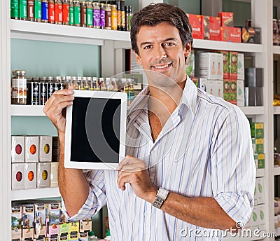 Man Showing Tablet In Grocery Store