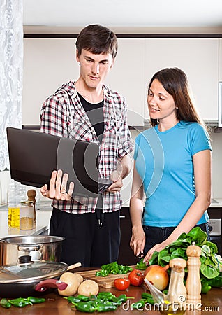 Man shows the new recipe to girl