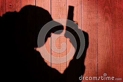 Man in silhouette with gun ready to shoot, XXXL