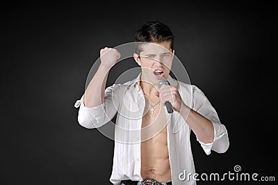Man singing with microphone.