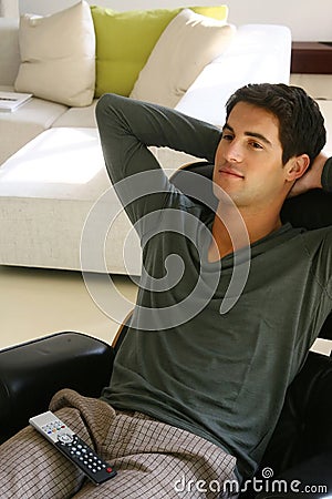 Man sitting on sofa watching tv