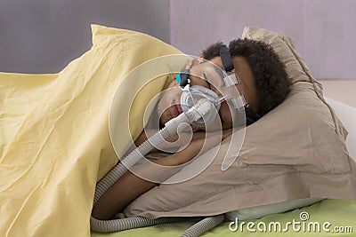 Man with sleeping apnea and CPAP machine