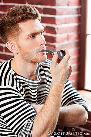 Man smoking pipe.