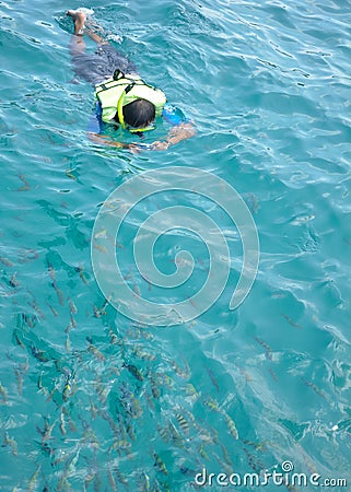 Man snorkeling take photo in clean ocean