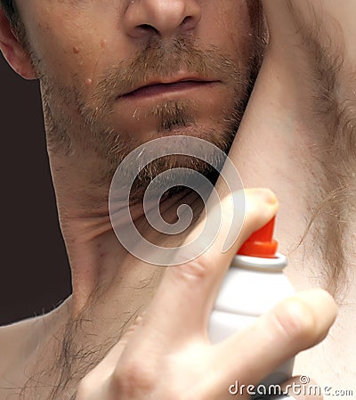 Man spraying deodorant