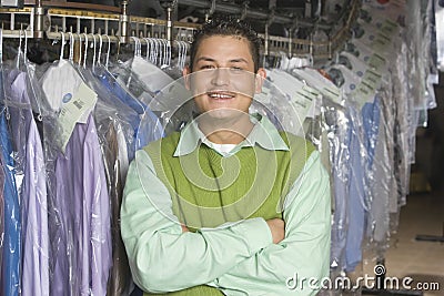 Man Standing In Front Of Clothes Rail