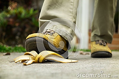 Man stepping on banana peel