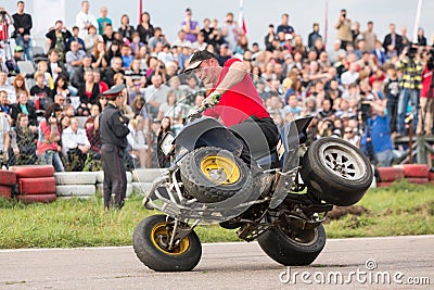 Man stunt shows on a quad bike