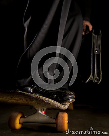 Man in Suit Riding Skateboard