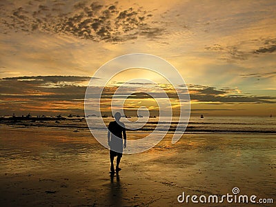 Man in the sunset on the beach in Costa Rica